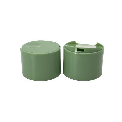 China Non Spill 24 Mm Green Disc Top Cap Double Wall Caps For Lotion Bottle for sale