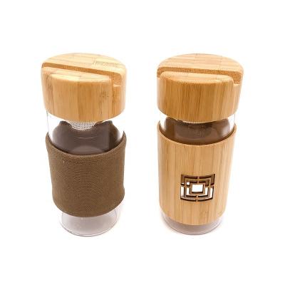 China 2020 Sustainable Best Selling Products Two Layers Leak Proof Tea Cup Glass Bottles With Bamboo Cap for sale