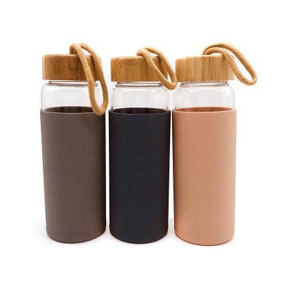 China Viable Promotional Leak Proof Bamboo Screw Lid 460ml Travel Glass Coffee Mug With Silicone Sleeve for sale