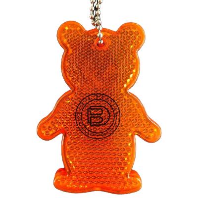 China Custom Bright Reflective Safety Printing Logo BEAR Shaped ABS HARD Plastic Key Chain Acrylic Reflective Orange Color Pendant for sale