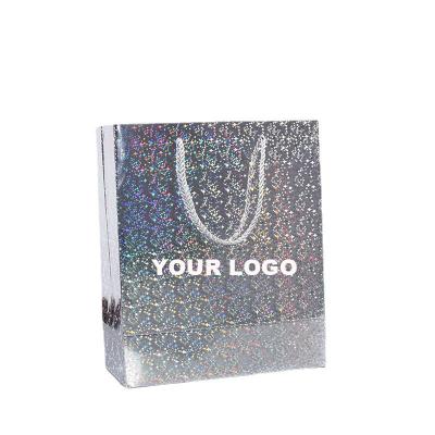 China Custom Recyclable Hologram Holographic Laser Paper Bag Kraft Printing Shopping Bag For Make Up Clothes Shoes Packaging With Handle for sale