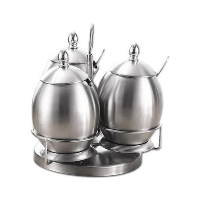 China Sustainable Egg Shape Seasoning Jar Set Rotating Type Spice Stainless Steel Bottles for sale