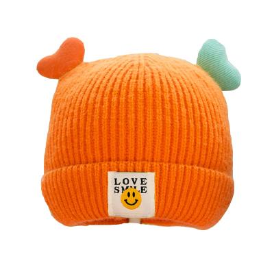 China 2022 JOINT factory direct sales new children's cute winter warm knitted hat for smile face for sale