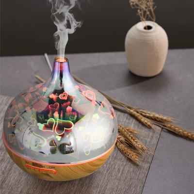 China Ultrasonic Fireworks Hotel Service Maid Aroma Diffuser 3d Glass Fantastic Essential Oil Lamp with Lights for sale