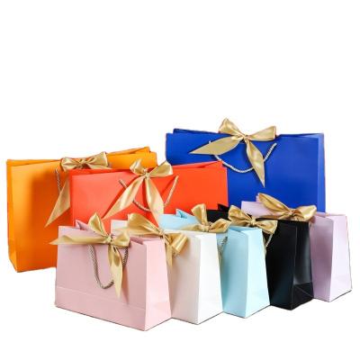 China Recycled Materials Paper Bags With Handles Solid Bow Christmas Wedding Wedding Gifts For Guests Mystery Box Packaging Wholesale Items For Business for sale