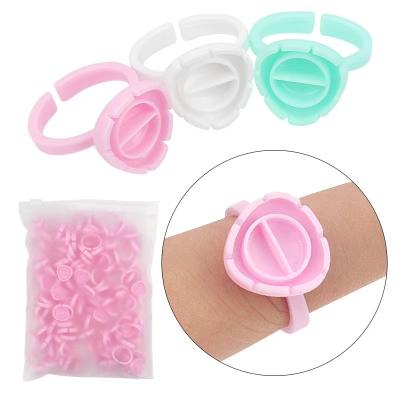 China New Heart Shape Eyelash Extension Tools Flower Plastic Disposable Eyelash Glue Ring Wholesale Glue Holder for sale