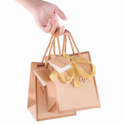 China Recycled Materials Logo Custom Clothing Boutique Paper Bulk Retail Shopping Bags With Your Own Logo for sale