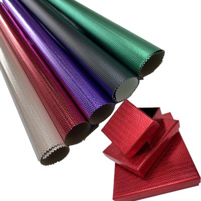 China Waterproof PE Laminated Plain Paper Aluminum Foil Textured Embossed Leatherette For Packing Boxes for sale