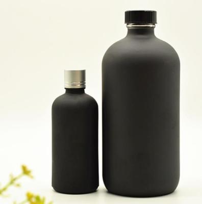 China Stock Available Black Paint 16oz Amber Glass Boston Round Bottles for sale