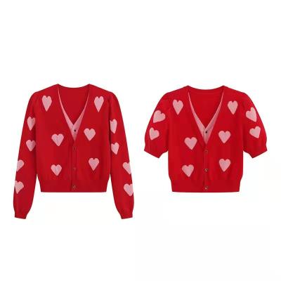 China Anti-wrinkle women's clothing 2022 straight women's sweater knitting buttons loose casual knitted sweaters heart cardigan for sale