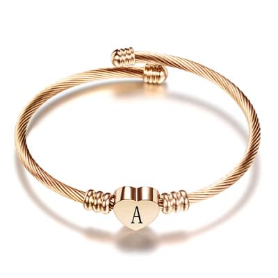 China Environmental Rose Gold Color Stainless Steel Heart Bangle Bracelet With Initial Letter Fashion Alphabet Charms Bracelets For Women for sale