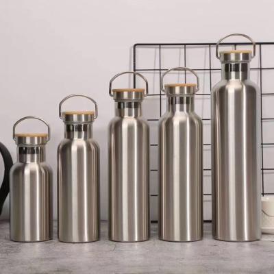 China Stocked Insulated Stainless Steel 350ml/500ml/600ml/750ml/1000ml Sports Water Bottle With Bamboo Top for sale