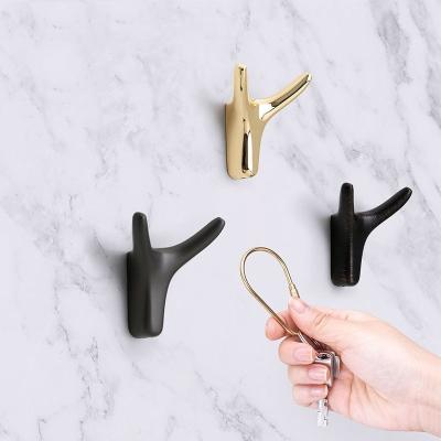 China Sustainable Wholesale Wall-mounted Bathroom Hook Metal Zamak Wall Hanger For Coat Hat Towel Hanging for sale