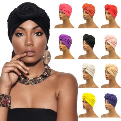 China Solid Color Flower Turban Hat Hijib Muslim Turban Wrap Hat Comfortable Knotted Head India Hat for sale