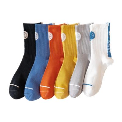 China Wholesale Breathable QUICK DRY absorb cotton sweat men's letter pure color middle tube thumps sports basketball men socks for sale