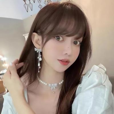 China FASHIONABLE High Quality Tassel Long Bow Women's Thin Face Thin Earrings Needle Earrings Silver Bow Bead Necklace Tide for sale