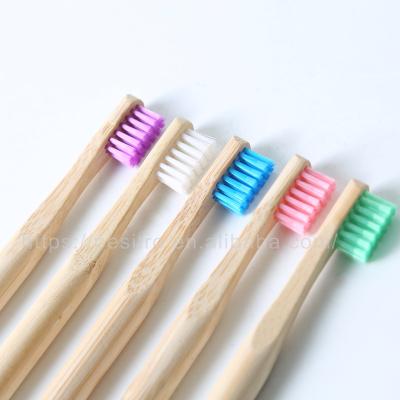 China Eco-friendly Biodegradable Kids Bamboo Toothbrush Round Handle With Customized Packaging And Logo for sale