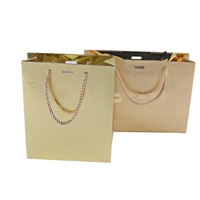 China China Biodegradable Competitive Price Brand Logo Luxury Boutique Shopping Gold Elegant Paper Customized Gift Bags With Ribbon Handles for sale