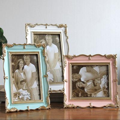 China Fashionable High Quality American Style Photo Frame Wedding Photo Desk Frame Resin Home Decor Home Living Room Picture Frames Popular Gift for sale