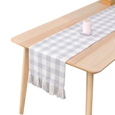 China Black and white stripe factory direct sales grid with tassel table flag tablecloth simple modern Nordic home table decoration for sale