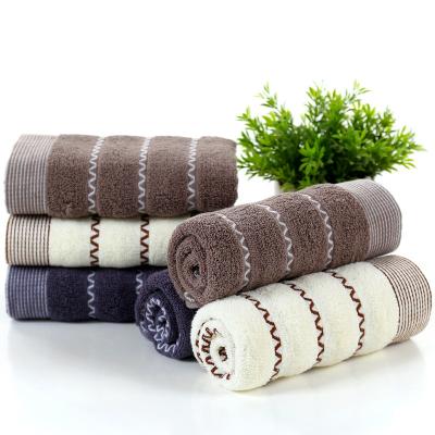 China New cotton face towel household solid color cotton wavy jacquard towel simple thick absorbent towel safe for water children for sale