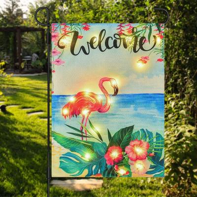 China 12*18inch Small FLYING Double Sided Polyester Led Lighted Garden Flag Banner Solar Flamingo Led Lighted Garden Flags for sale