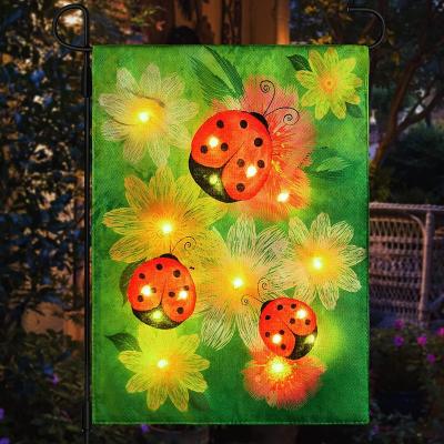 China 12*18inch Small FLYING Double Sided Polyester Led Lighted Garden Flag Banner Solar Beetle Led Lighted Garden Flags for sale