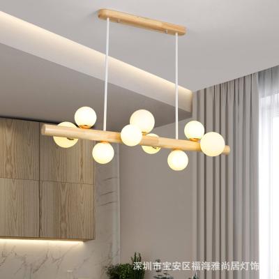 China Lighting Now Working Living Room Home Decor Multiple Bulb Lighting System Hanging Linear Pendant Light Wood for sale