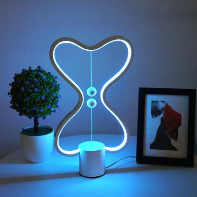 China Modern Magnetic Balance Lamp Bedroom Smart Creative Bedside Lamp Dimming Desk Bar Atmosphere Table Lamp for sale