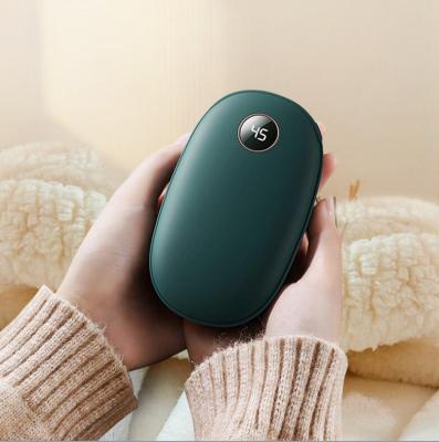 China Newest Cute Multifunctional Design 10000mAh Power Bank and Hand Warmer Electric Hand Warmer Fast Heater for Christmas Gift for sale