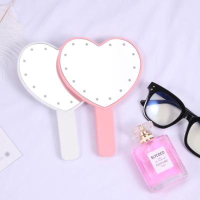 China New Arrival Heart-Shaped Comfortable Mirror Lighted Glitter Handle LED Lighted Makeup Mirror for Masquerade for sale