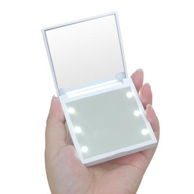 China Wholesales Lighted 2X Magnifying Small Double Sided Folding LED Light Makeup Cosmetic Mirror for sale