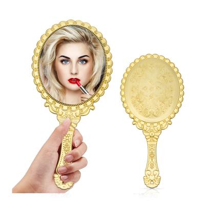 China Customized Hand Held Vintage Makeup Mirror Antique Gold Logo Wholesale Single Side Metal Hand Held Mirror Lighted Hand Mirror for sale