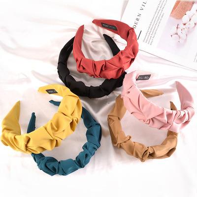 China Pure color wash headband women new style crooked fold hair band fashion cloth headband European and American simple iron yarn for sale