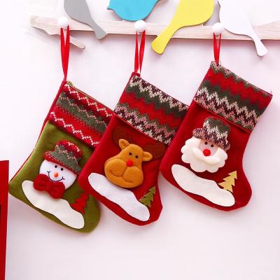 China Cloth 2022 christmas decorations santa gift bag new year eve felt xmas decoration christmas stocking for sale