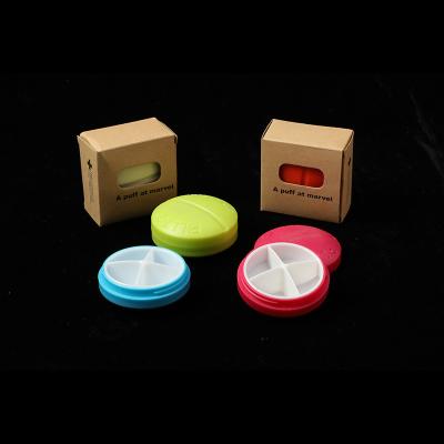 China Mini Multicolor 4 Grid Pill Box Portable Round Travel Viable Cute Divided Sealed Storage Box for sale