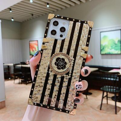 China Luxury Girl News Designer Branded Square Trunk Phone Cases Shockproof Cell Phone Covers For Samsung for sale