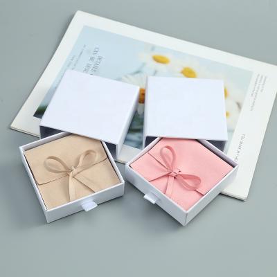 China Wholesale Custom Foldable Jewelry Box Soft And High Quality Logo Paper Box Phone Box Cosmetics Series Suit Packaging for sale