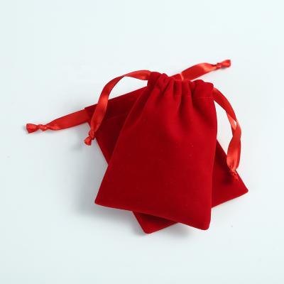 China Soft and high quality velvet jewelry pouches bags red velvet fabric jewelry pouches drawstring bags for jewelry bracelets and watches for sale