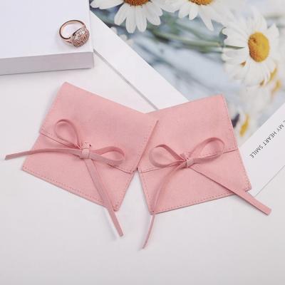 China Luxury 8x8cm soft pink and high quality gift printed chic jewelry pouch wholesale velvet jewelry gift bag for sale