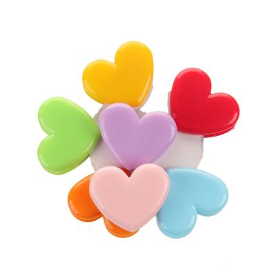 China Multifunctional Hot Selling Amazon Heart Shape Color Plastic Spring Clips For Office Binding Stationery for sale