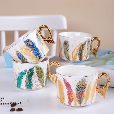 China European Style 200ml Luxury Ceramic Angel Wings Tea Cup Reusable Espresso Coffee Cup And Saucer Set With Nib for sale