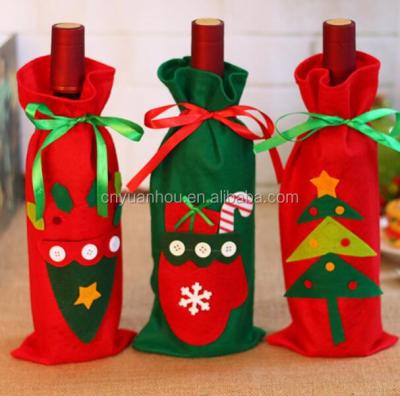 China Promotional Nonwoven Fabric Christmas Hat Pattern Drawstring Wine Bottle Bag Gift Wine Bottle Pouch for sale