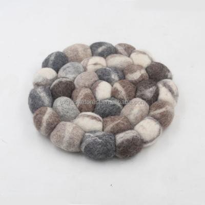 China Sustainable natural and eco lnsulating mat, handmade felted stone shaped place mats, high quality hot balls pot mats 20cm for sale