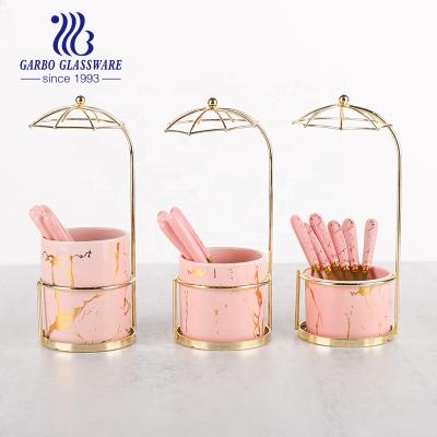 China Goldenware Sustainable Set With Shelf 410 Stainless Steel Tea Support Spoon Set Pink Marbling Ceramic Cutlery Set for sale