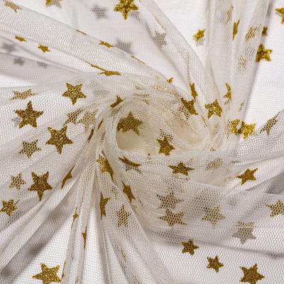 China High quality five-pointed star stretch star white ground glitter 100% polyester 40D shiny mesh fabric for dress garment for sale