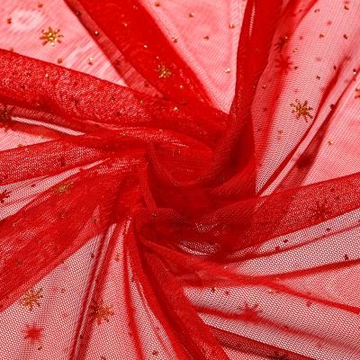 China High Quality Red Ground Stretch Show Snowflake Glitter 100% Polyester 40D Shiny Mesh Fabric For Dress for sale