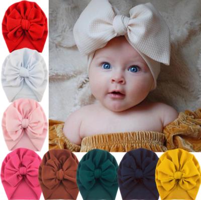 China Polyester New Design Baby Knit Pompom Pleated Bubble Hats With Big Bow for sale