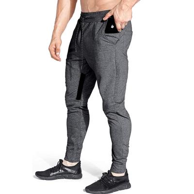 China Custom Mens Cotton Zipper Pocket Breathable Fitness Jogging Pants Stack Workout Elastic Sweatpants for sale