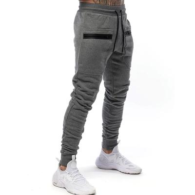 China New Design Solid Color Breathable Elastic Men Pants Casual Pockets Pants Fitness Joggers For Men for sale